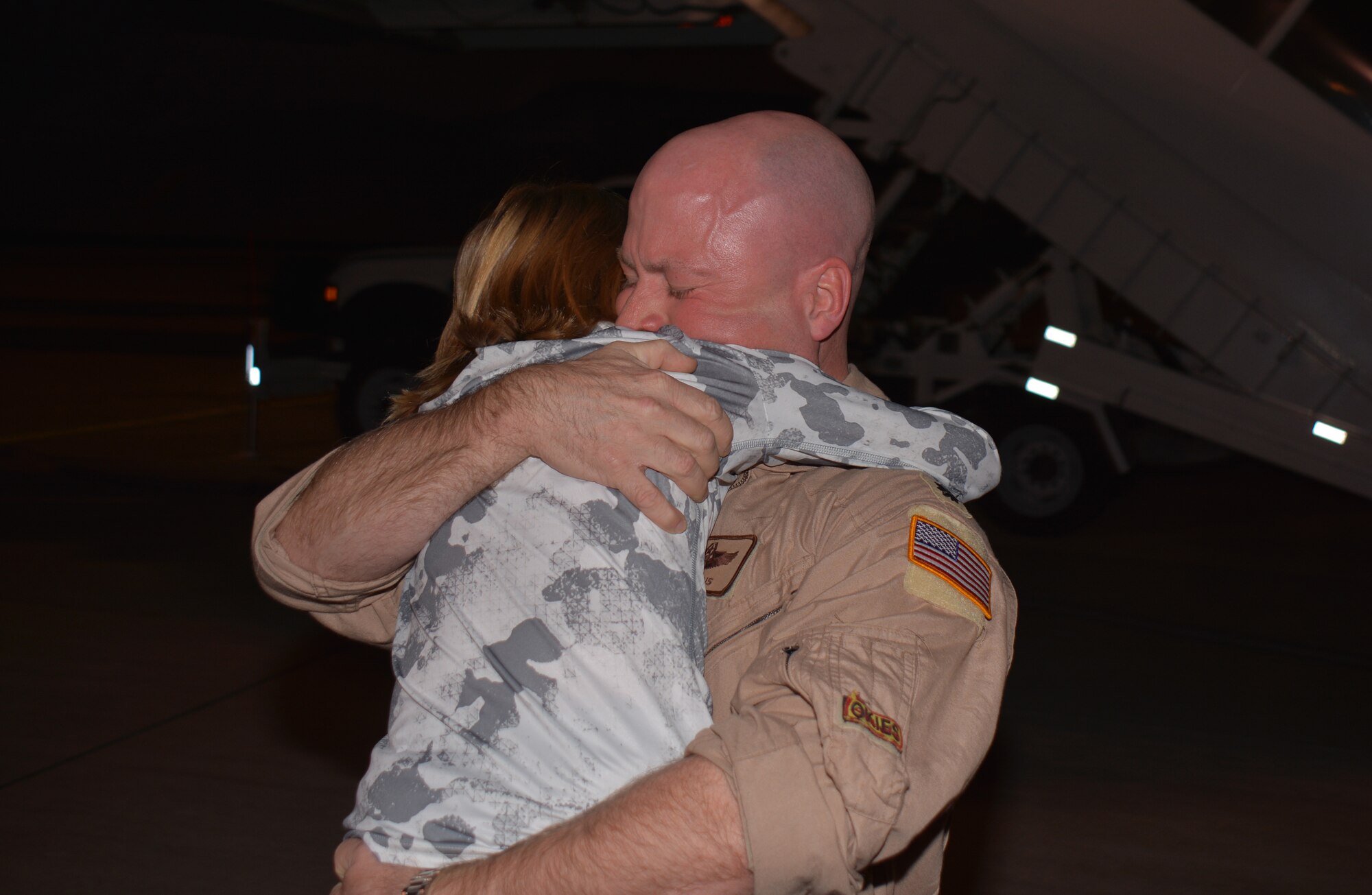 Lt. Col Benjamin Evans, 465th Air Refueling Squadron embraces his son after returning from a
deployment in Southwest Asia here Dec. 11. (U.S. Air Force Photo/Maj. Jon Quinlan)
