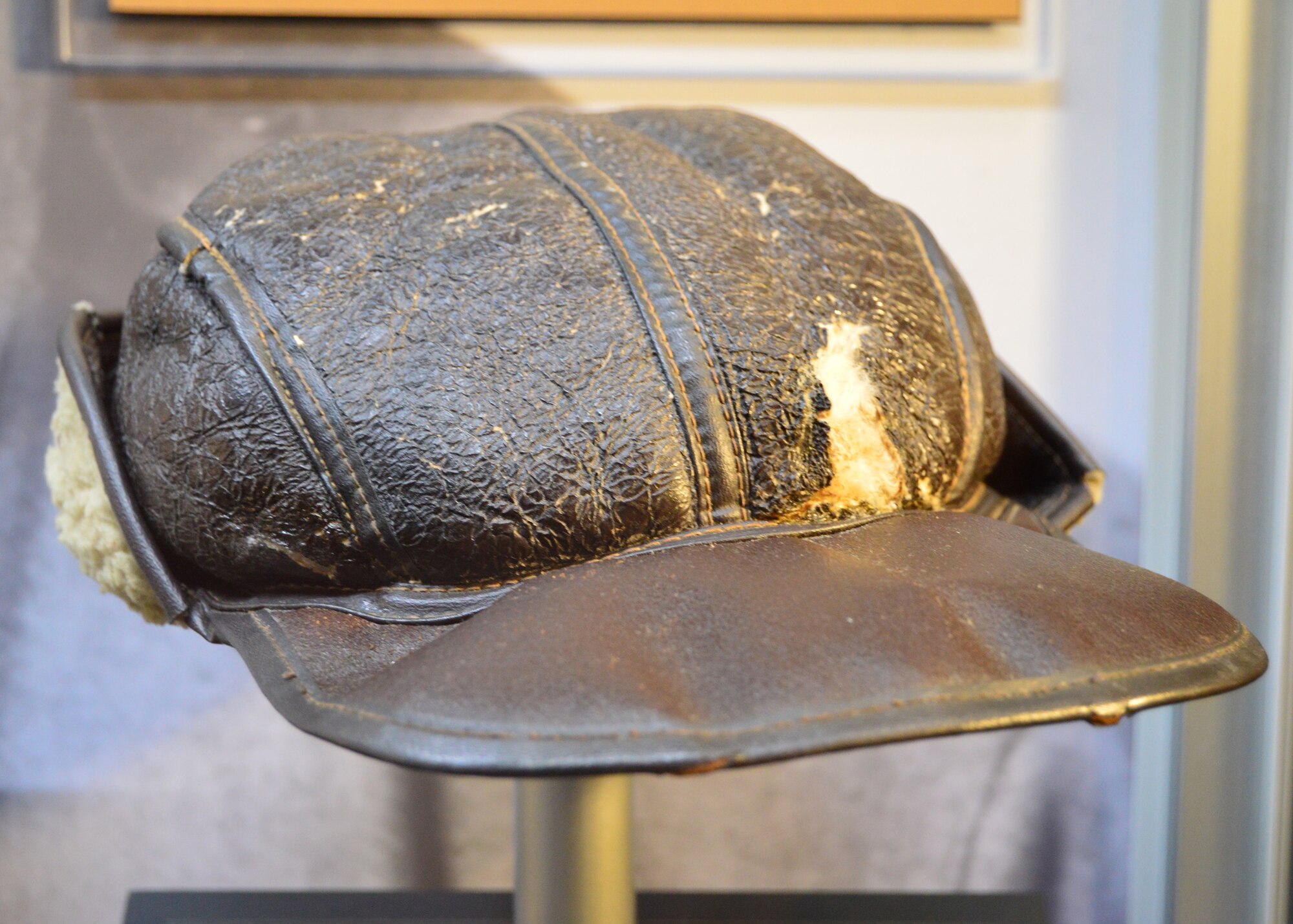 DAYTON, Ohio -- Lt. Hathcock's leather cap on display in the WWII Gallery at the National Museum of the U.S. Air Force. Captured in Italy during the summer of 1944, Lt. (later Maj.) Lloyd "Scotty" Hathcock spent the rest of the war in Stalag Luft III and Stalag VII-A prison camps. After the war, Hathcock stayed in the service and helped to desegregate the U.S. Air Force. (U.S. Air Force photo)
