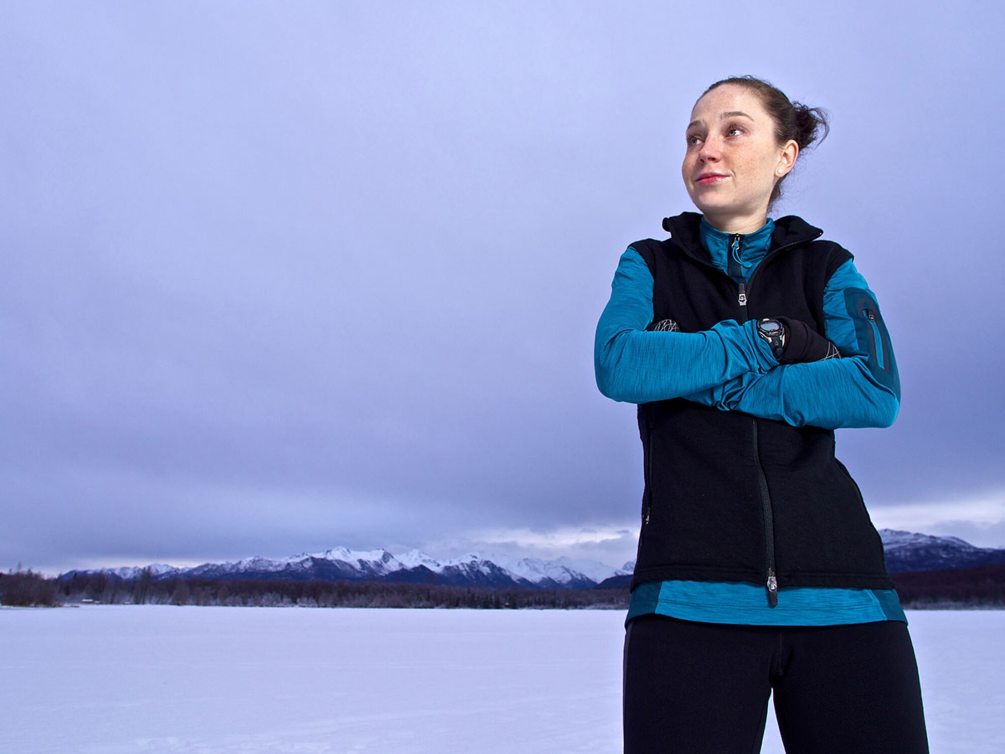 Air Force Capt. Caitlin Oviatt, 673d Air Base Wing executive officer, demonstrates the posture she assumes before a foot race, which allows her to size up her competition. During the 25-mile Frosty Bottom foot race, Oviatt’s nutrition and water froze, forcing her to improvise in order to finish the race. Not only did the officer finish the race, she beat the course record for women by 15 minutes. (U.S. Air Force photo/David Bedard)