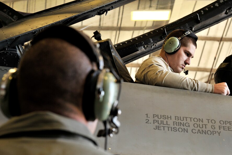U.S. Air Force Senior Airman Tyler Kuhn, 20th Component Maintenance Squadron fuels systems journeyman, watches the fuel gauges in an F-16CM Fighting Falcon to ensure the proper distribution of fuel at Shaw Air Force Base, S.C., Jan. 16, 2015. Fuel is distributed evenly throughout the aircraft to prevent one side of the aircraft from weighing more than the other. (U.S. Air Force photo by Airman 1st Class Jonathan Bass/Released)