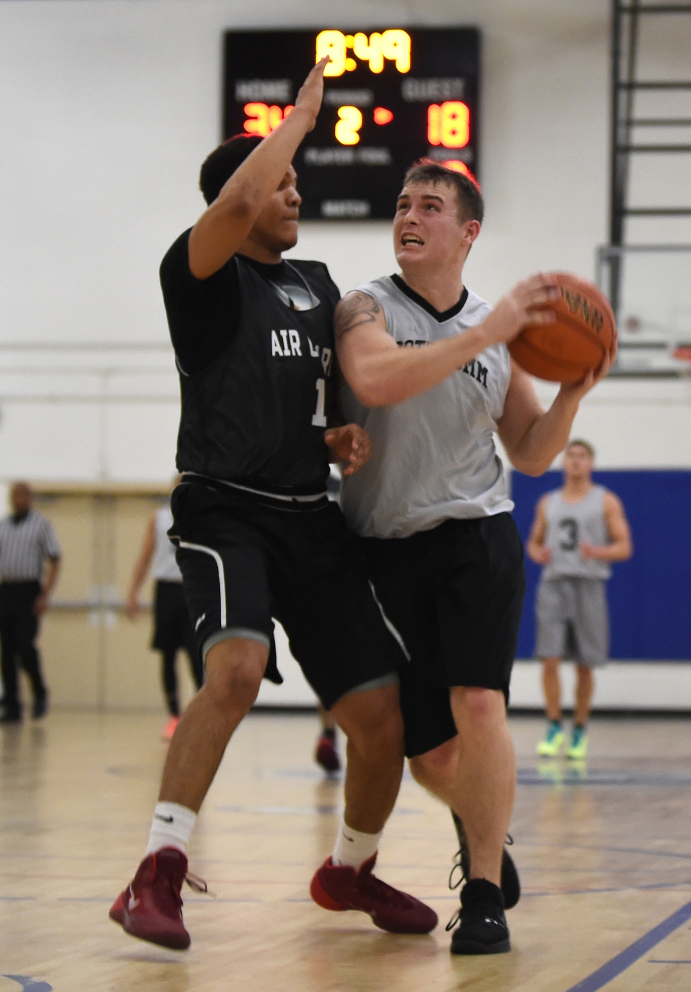 Staff Sgt. Matthew Miller, 89th Communications Squadron shooting guard, eyes the basket during an intramural game at the West Fitness Center on Joint Base Andrews, Md., Jan. 15, 2015. Miller and the 89 CS won the game and are currently second place in the Tuesday/Thursday intramural standings behind 744th Communications Squadron. (U.S. Air Force photo/Airman 1st Class Philip Bryant)