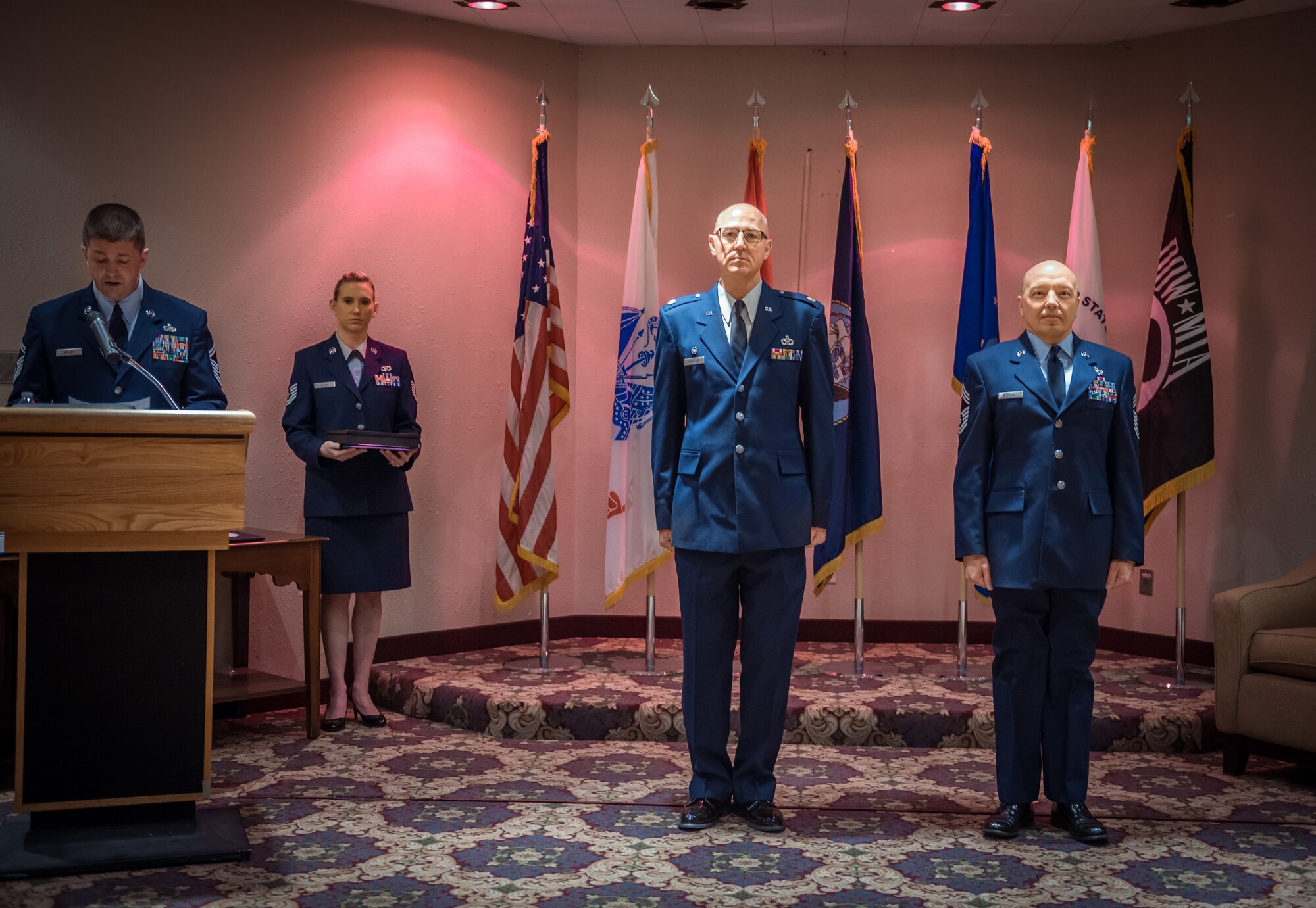 (From right) Chief Master Sgt. Dale Klossner, 934th Civil Engineer Squadron, retires with a ceremony officiated by Maj. Steven Christoff, 934 CES commander, in the Services Club at the Minneapolis-St. Paul Air Reserve Station, Minn., Jan. 10.  Chief Klossner ends his career at the 934th Airlift Wing with over 33 years of service.  (U.S. Air Force photo by Shannon McKay/Released)