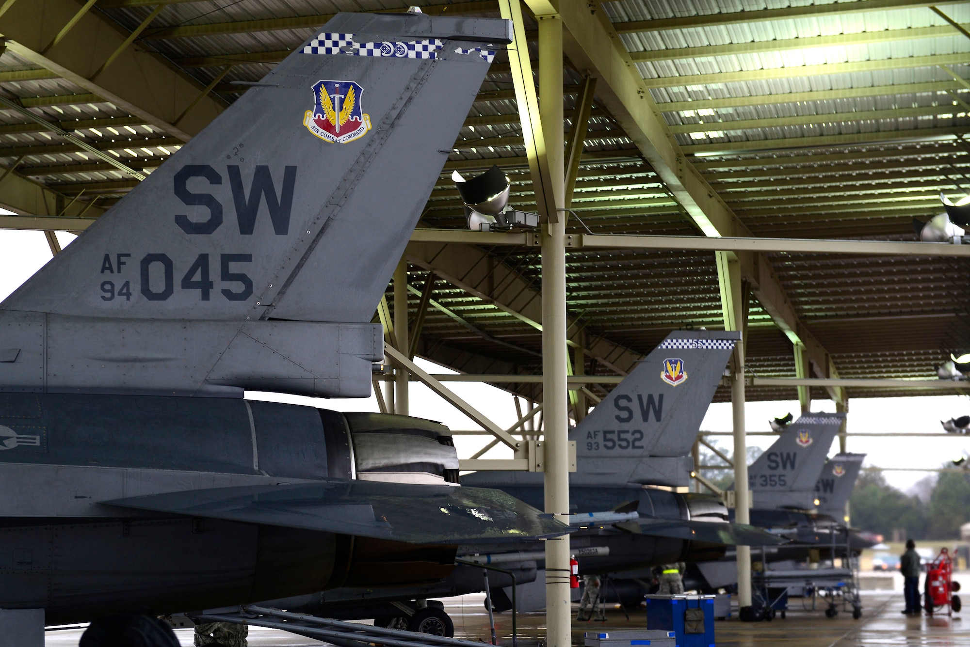 U.S. Air Force F-16CM Fighting Falcons are prepped for take-off during a surge at Shaw Air Force Base, S.C., Jan. 13, 2015. The surge is an increased day and night operation for Airmen to practice their readiness and capabilities which lasted five days. (U.S. Air Force photo by Airman 1st Class Diana M. Cossaboom/Released)