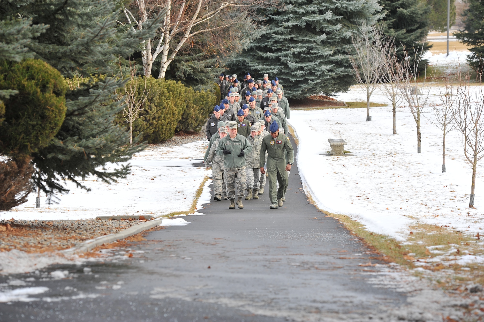 Col. Brian McDaniel, 92nd Air Refueling Wing commander, and Staff Sgt. Ladarious Malone, 92nd Air Refueling Squadron boom operator, lead a march in remembrance of Dr. Martin Luther King Jr.’s birthday Jan. 14, 2015, at Fairchild Air Force Base, Wash.  Roughly 100 people came out to support the march and the observance following. (U.S. Air Force photo/Staff Sgt. Veronica Montes)