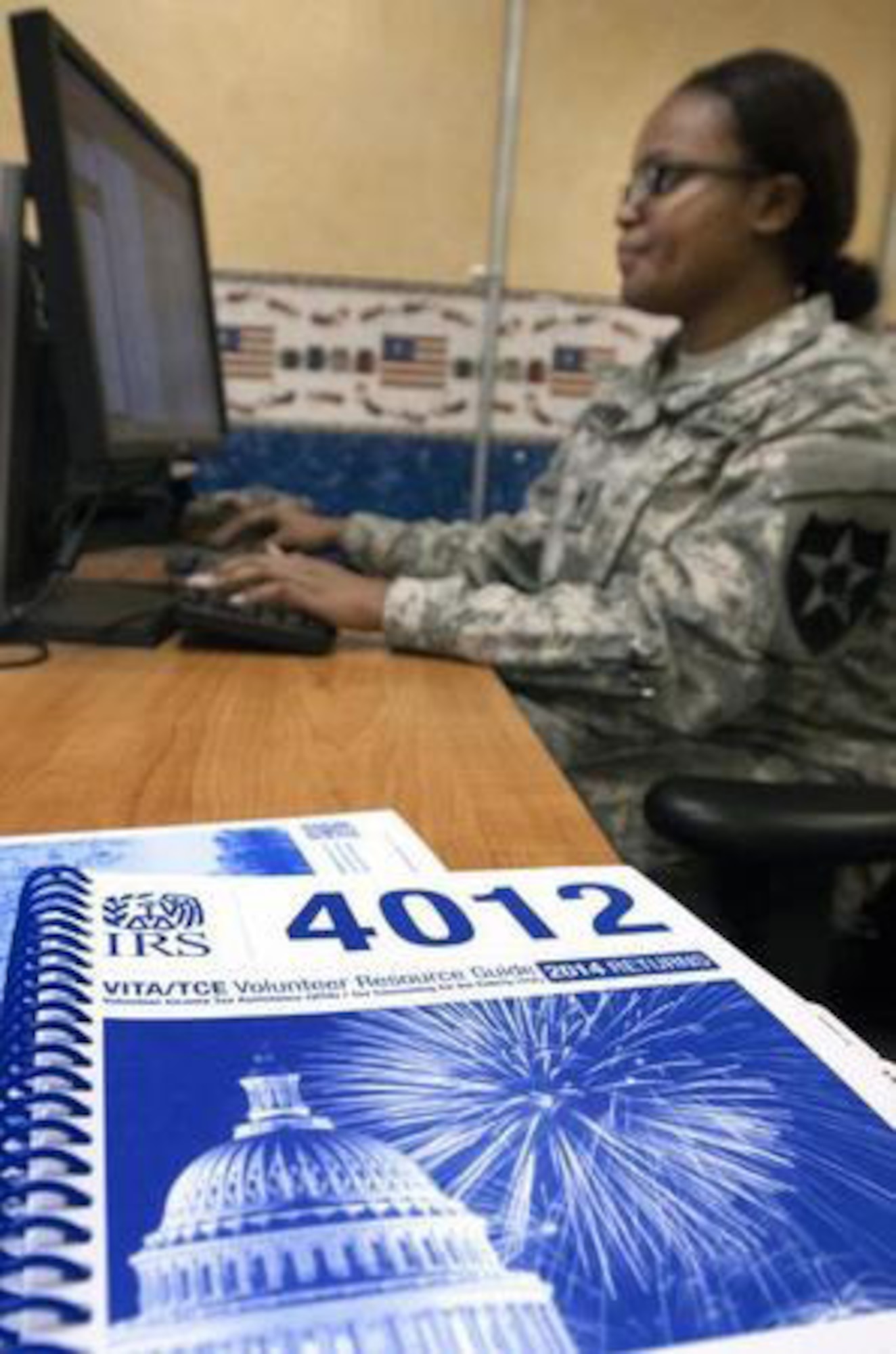 Staff members at the JBLM Tax Center, like Spc. Vtessa Johnson, are busy preparing for the upcoming tax season. (Northwest Guardian/courtesy photo)