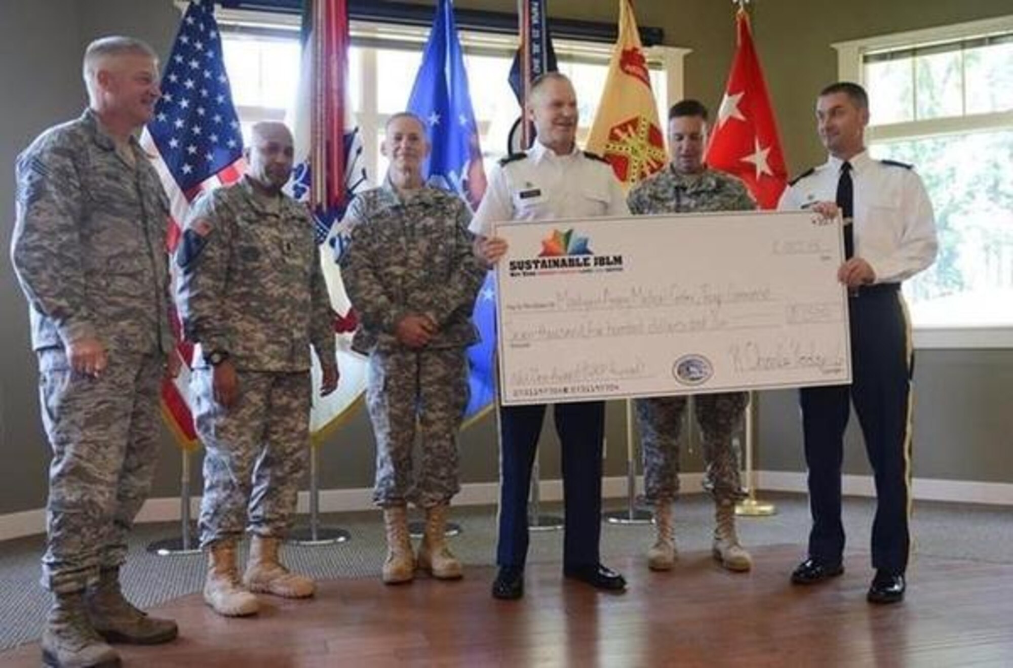 Service members, civilians and Net Zero winners receive awards during a recent quarterly ceremony at Eagles Pride Golf Course. (Norhtwest Guardian/courtesy photo)