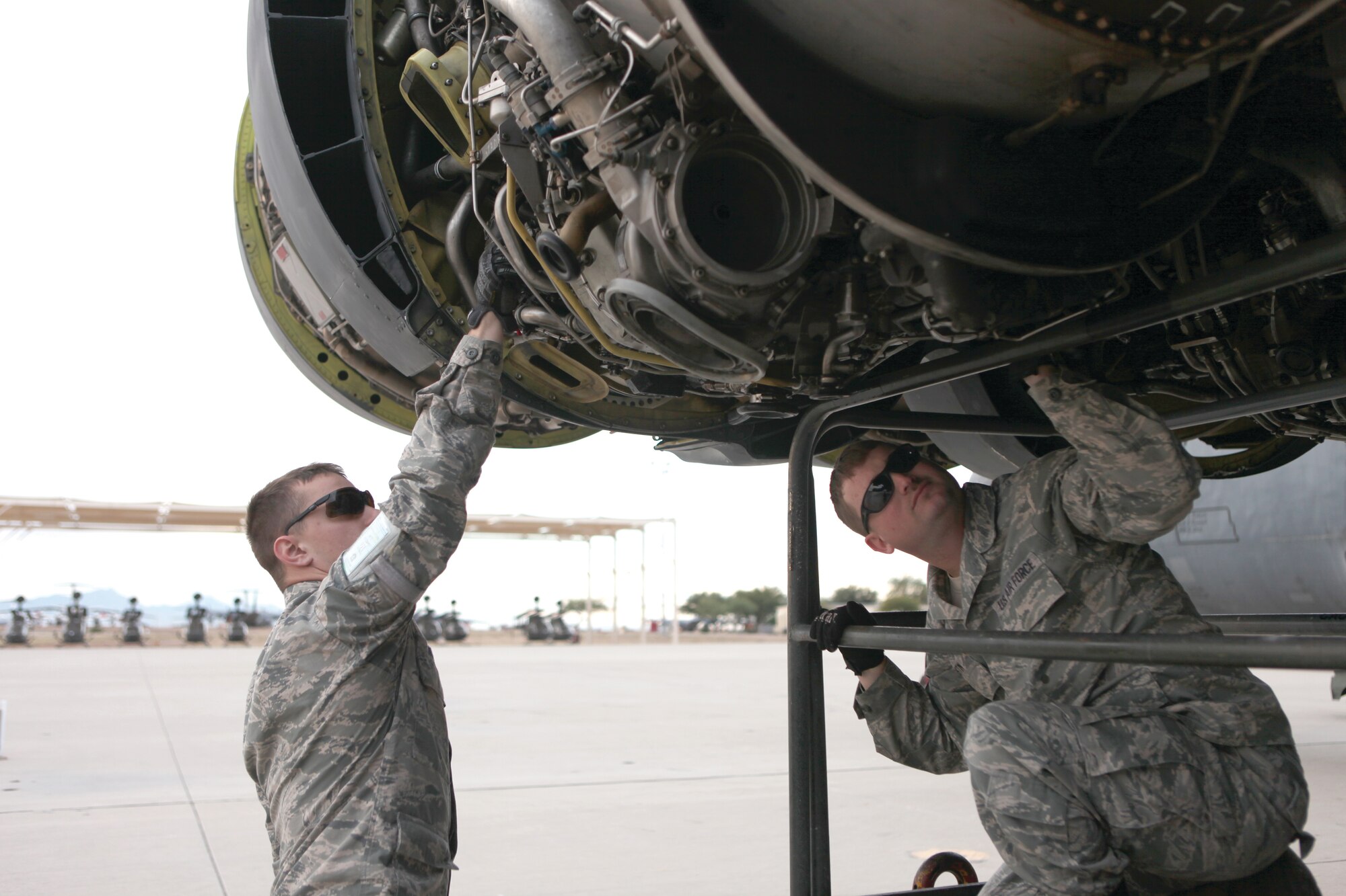 Senior Airman Cody Grauel, Air Force Global Strike Command’s 2nd Maintenance Squadron, left, inspects the No. 3 engine fuel pump on B-52H serial number 61-0007, the Ghost Rider, while Staff Sgt. Bradley Austin, with the Air Force Reserve Command’s 917th Maintenance Squadron, inspects the No. 3 engine hydraulic pump. Tinker’s B-52 System Program Office is one part of a team of units working together to get the B-52 back in flying condition to rejoin the Air Force fleet. (Air Force photo by Teresa Pittman, AMARG)