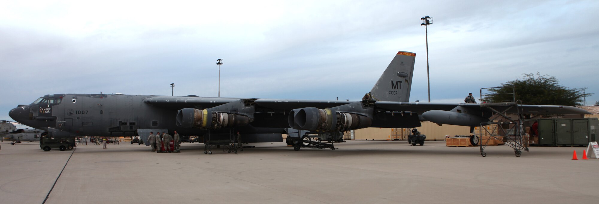 While some personnel inspect the top of the left wing, others prepare to work in the No. 1 wheel well, as the aircraft sits in the Air Force’s “Boneyard” at Davis-Monthan Air Force Base, Ariz. (Air Force photo by Teresa Pittman, AMARG)