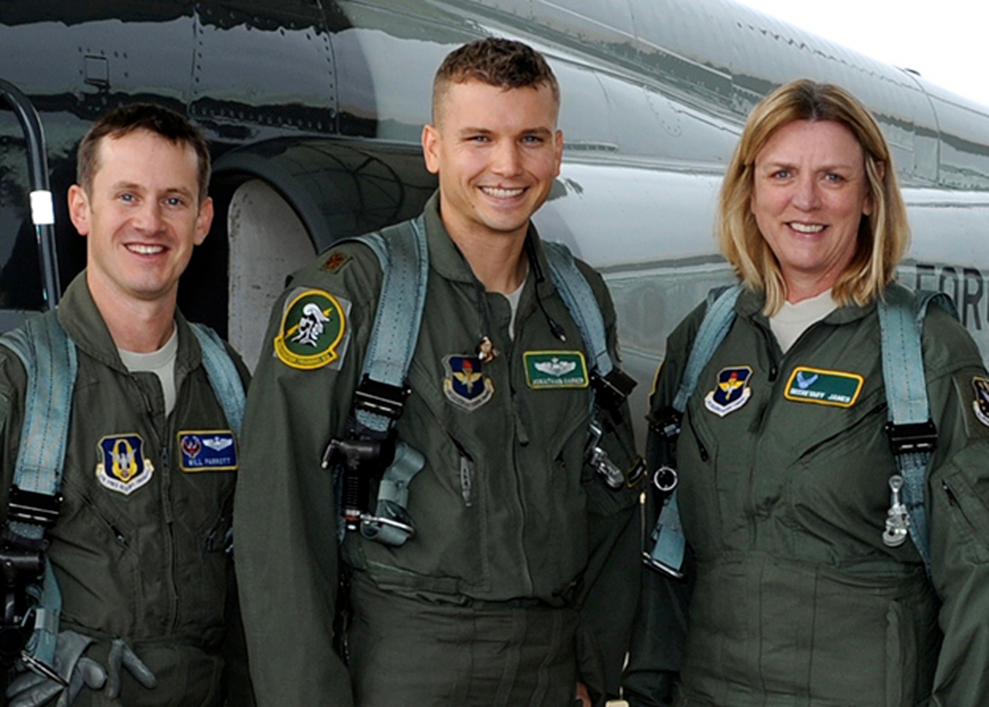Secretary of the Air Force Deborah Lee James, Maj. William Parrott, 43rd Flying Training Squadron Assistant Flight Commander, and Maj. Jonathan Garner, 49th Fighting Training Squadron Instructor Pilot, pause for a photo before a flight in a T-38 Dec. 18 on Columbus Air Force Base, Mississippi. The flight was to demonstrate to the Secretary how Columbus AFB trains future fighter pilots. (U.S. Air Force photo/Elizabeth Owens)