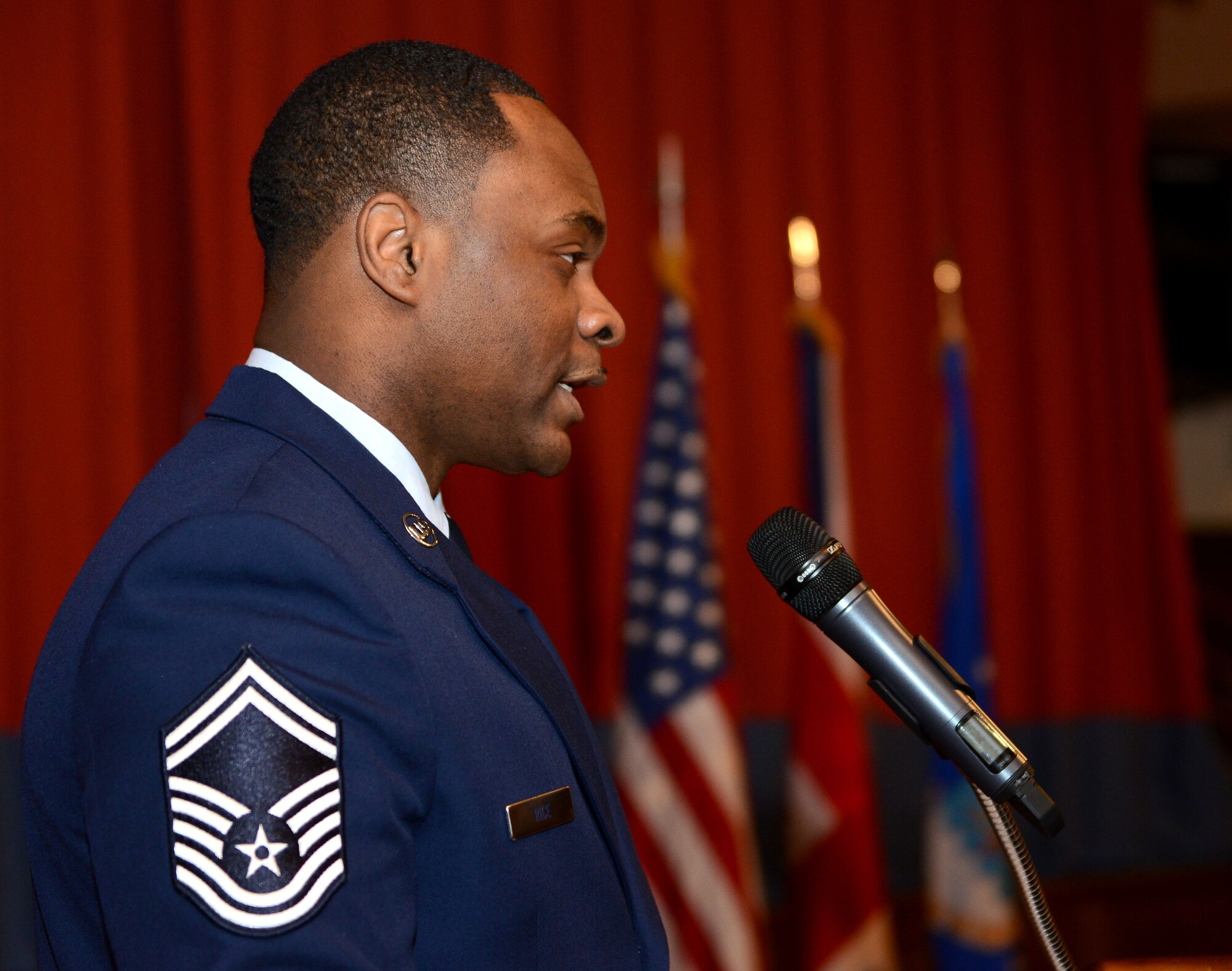 U.S. Air Force Senior Master Sgt. Edwin Rice, 100th Force Support Squadron manpower superintendent from Baltimore, Md., serves as the guest speaker during a Dr. Martin Luther King Jr. birthday observance luncheon Jan. 16, 2015, at the Galaxy Club on RAF Mildenhall, England. Along with describing the many ways King influenced justice and equality in America, Rice described how he personified the Air Force Core Values — Integrity First, Service Before Self and Excellence in All We Do. (U.S. Air Force photo by Senior Airman Kate Maurer/Released)