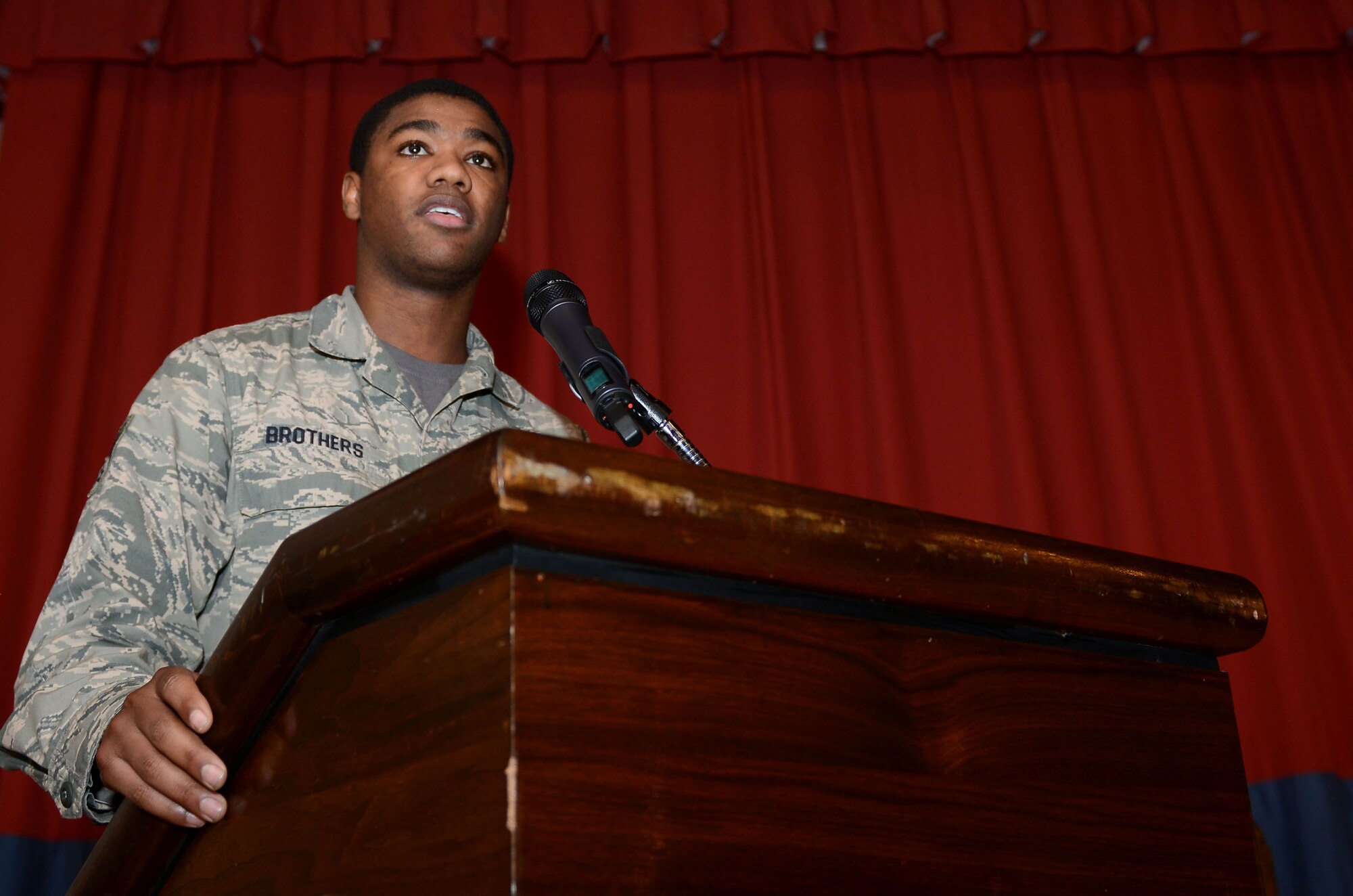 U.S. Air Force Senior Airman Justin Brothers, 100th Logistics Readiness Squadron traffic management journeyman from Bethany, Okla., gives a personal speech during a Dr. Martin Luther King Jr. birthday observance luncheon Jan. 16, 2015, at the Galaxy Club on RAF Mildenhall, England. The Airman received a standing ovation for his speech revealing his personal admiration of King, a pastor, activist, humanitarian and leader in the African-American Civil Rights Movement. (U.S. Air Force photo by Senior Airman Kate Maurer/Released)