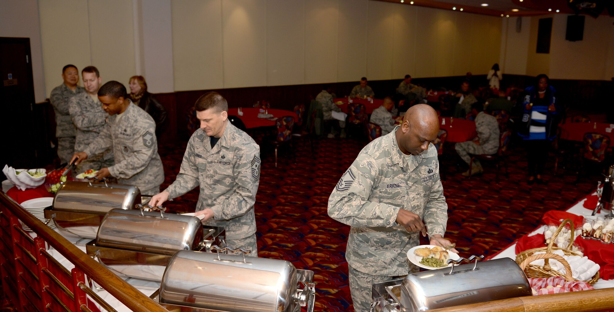 Team Mildenhall members plate their food during a Dr. Martin Luther King Jr. birthday observance luncheon Jan. 16, 2015, at the Galaxy Club on RAF Mildenhall, England. King was a pastor, activist, humanitarian and leader in the African-American Civil Rights Movement, famously known for his “I Have a Dream” speech delivered Aug. 28, 1963, at the Lincoln Memorial, Washington, D.C. (U.S. Air Force photo by Senior Airman Kate Maurer/Released)
