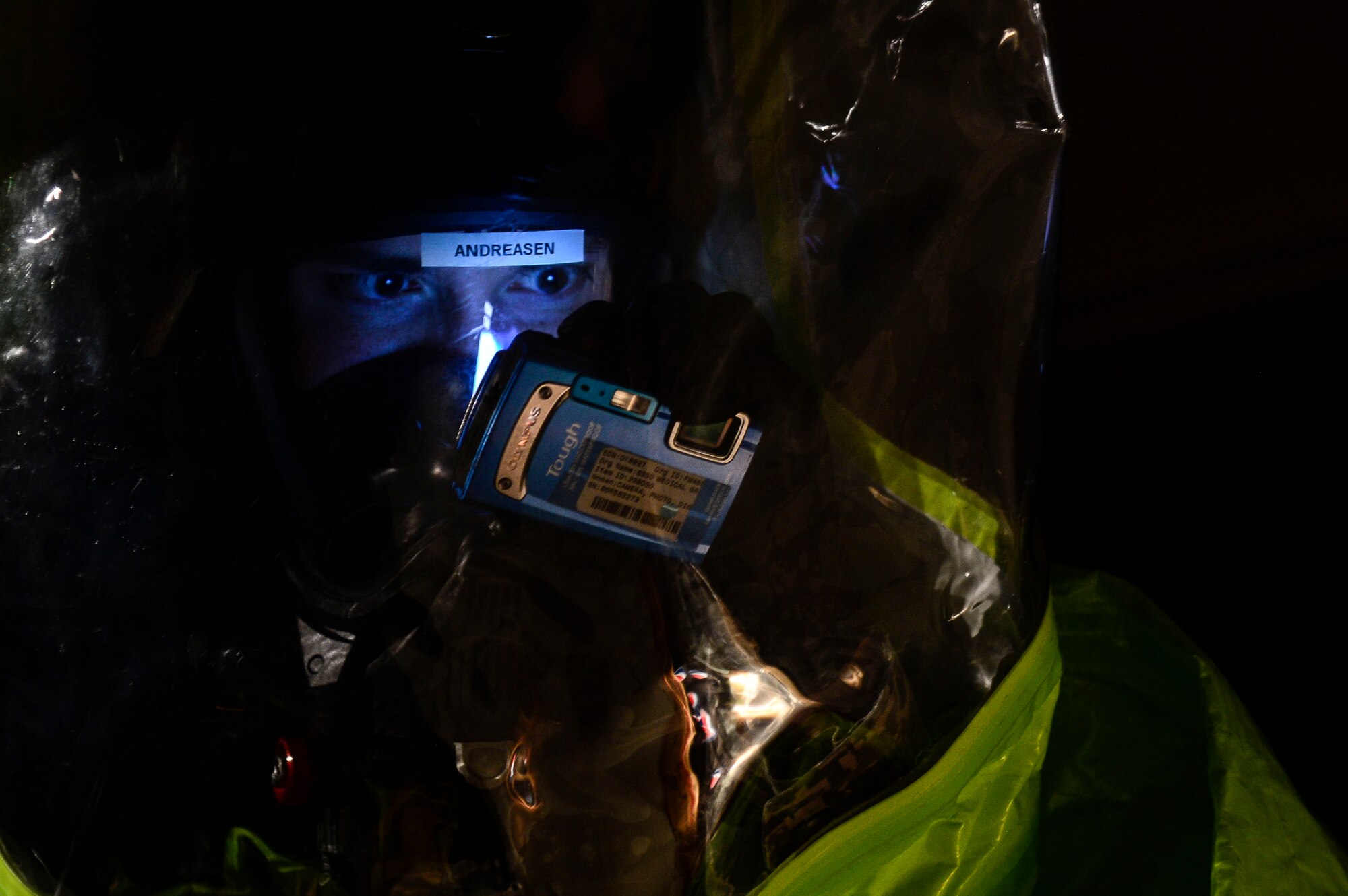 U.S. Air Force Airman 1st Class Taylor Andreasen, 633rd Aerospace Medicine Squadron bioenvironmental engineer technician, takes a picture of a simulated contaminated area during Integrated Base Emergency Response and Capability training at Langley Air Force Base, Va., Jan. 14, 2015. A team of emergency responders were tasked with entering a contaminated zone and testing the levels of hazardous materials. (U.S. Air Force photo by Senior Airman Kayla Newman/Released) 