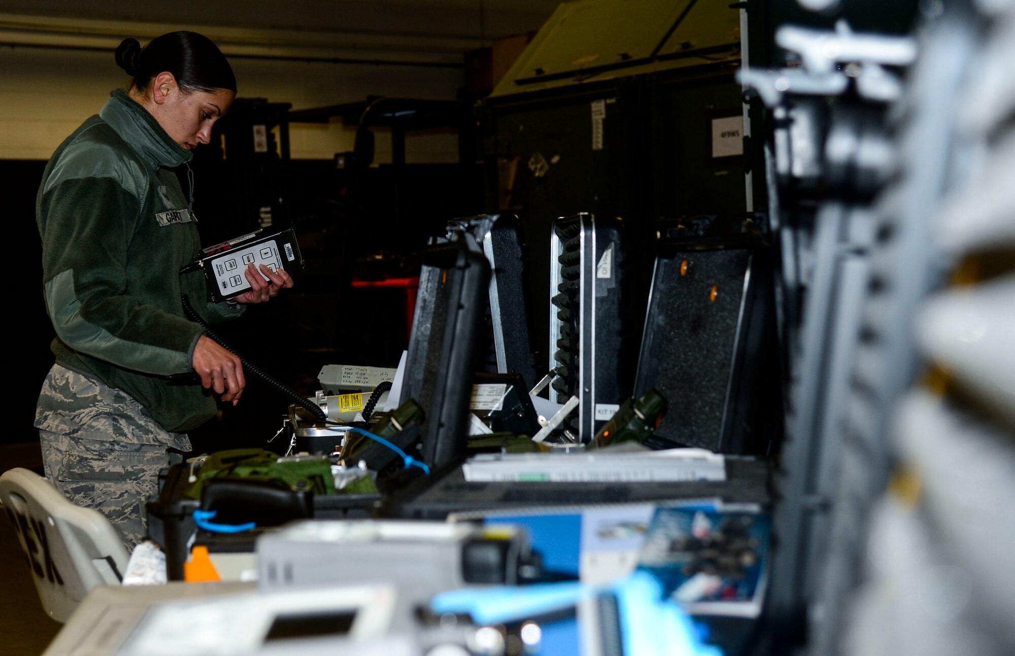 U.S. Air Force Senior Airman Michelle Garrett, 633rd Civil Engineer Squadron emergency management technician, performs operation checks on equipment needed for Integrated Base Emergency Response and Capability training at Langley Air Force Base, Va., Jan. 14, 2015. The equipment was used to detect simulated hazardous materials and contamination levels during the training. (U.S. Air Force photo by Senior Airman Kayla Newman/Released) 