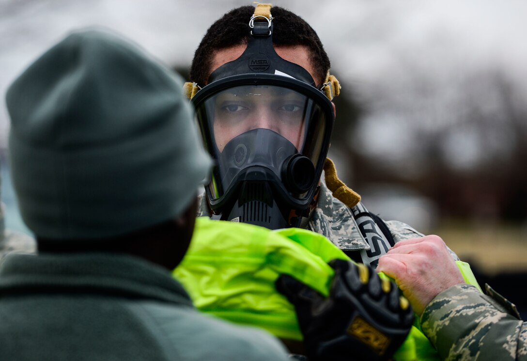 U.S. Air Force Airman 1st Class Alex McClendon, 633rd Aerospace Medicine Squadron bioenvironmental engineer technician, prepares to enter a simulated contaminated area during Integrated Base Emergency Response and Capability training at Langley Air Force Base, Va., Jan. 13, 2015. IBERCT was designed to ensure Joint Base Langley-Eustis is protected from potential chemical, biological, radiological, nuclear and high-yield explosive threats. (U.S. Air Force photo by Senior Airman Kayla Newman/Released) 
