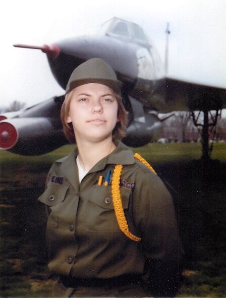 Then Airman Basic Melena Quetel, who’s currently the 46th Aerial Port Squadron education and training manager, stands in front of a static aircraft on Chanute Air Force Base, Ill., where she attended technical training as a parachute and fabrication specialist. Known as Airman Linz at the time, she wore a yellow rope on her uniform, signifying greater responsibility and supervision authority of a flight. (Courtesy photo)