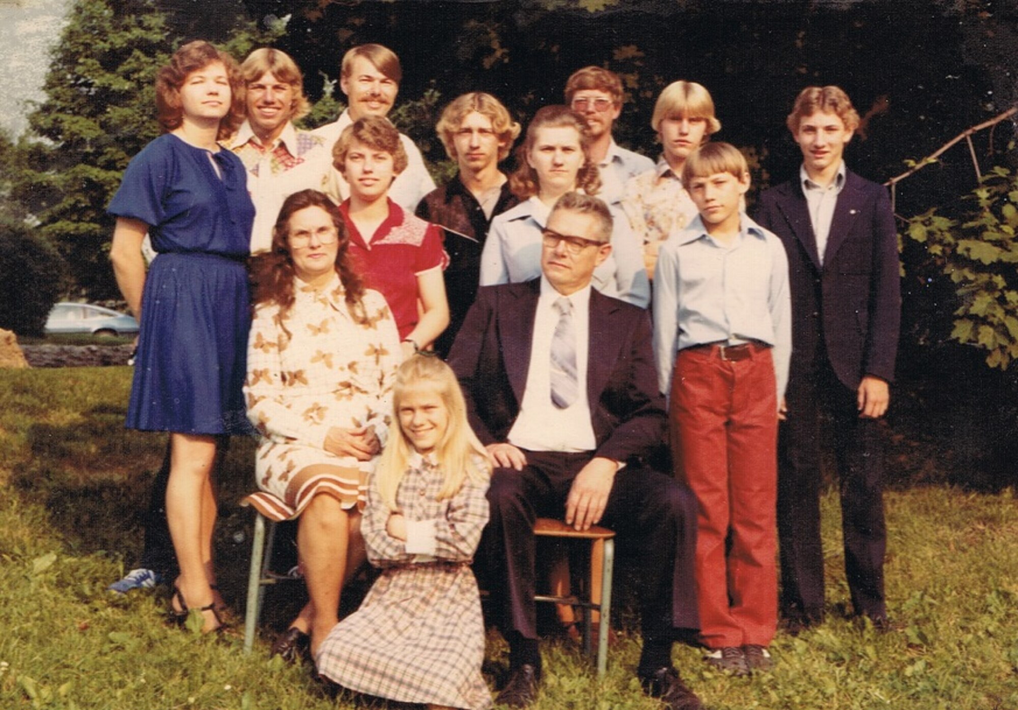 Tech. Sgt. Melena Quetel (red shirt), stands behind her parents in a family photo taken in Ohio in 1982. Quetel, a 46th Aerial Port Squadron reservist, was the first of 11 children in her family to join the military. Three younger brothers followed behind Quetel and joined the military and served from the mid 1980s to the mid 1990s. (Courtesy photo)