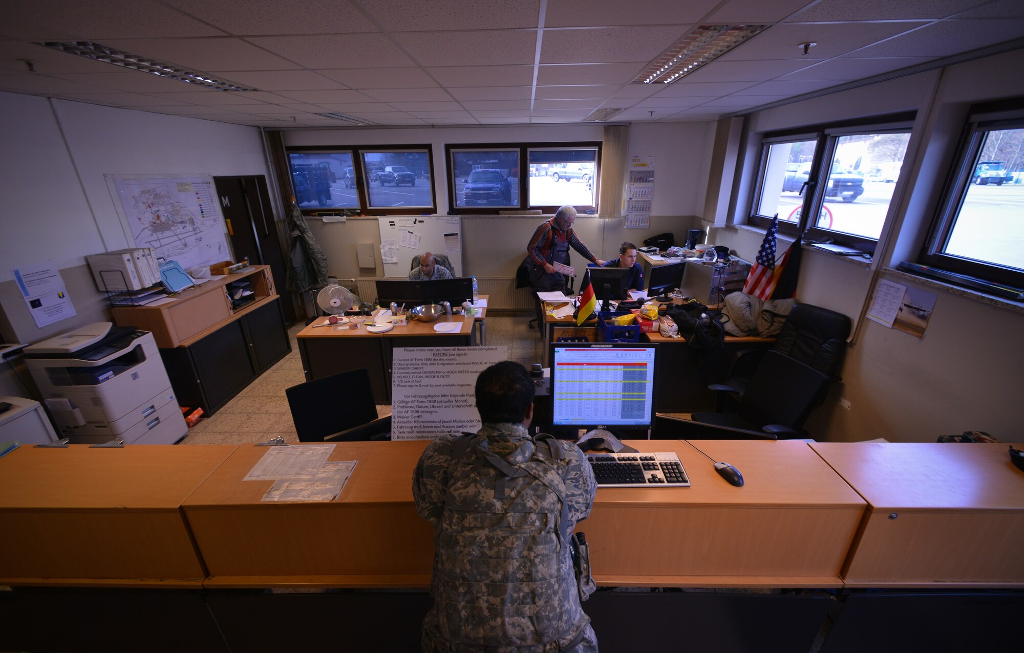 A customer waits at the counter at the 86th Vehicle Readiness Squadron customer service counter at Ramstein Air Base, Germany, Jan. 14, 2015. Customers submit work order requests to have their vehicles inspected before repair.  (U.S. Air Force photo by Senior Airman Nicole Sikorski/Released)