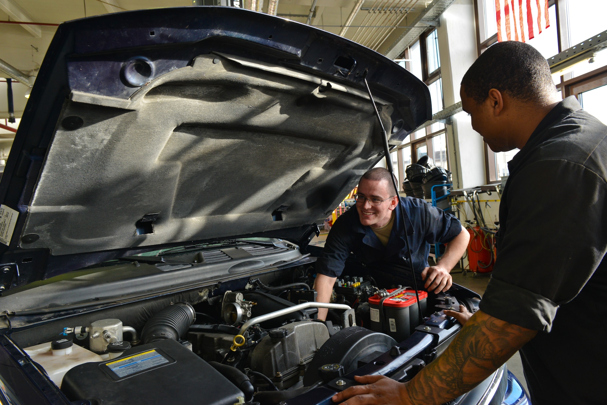 Airman 1st Class Frederick Vogelgesang, 86th Vehicle Readiness Squadron general purpose light vehicle mechanic, works under a truck at Ramstein Air Base, Germany, Jan. 14, 2015. The 86th VRS is responsible for servicing more than 1000 vehicles on and off base. (U.S. Air Force photo by Senior Airman Nicole Sikorski/Released)