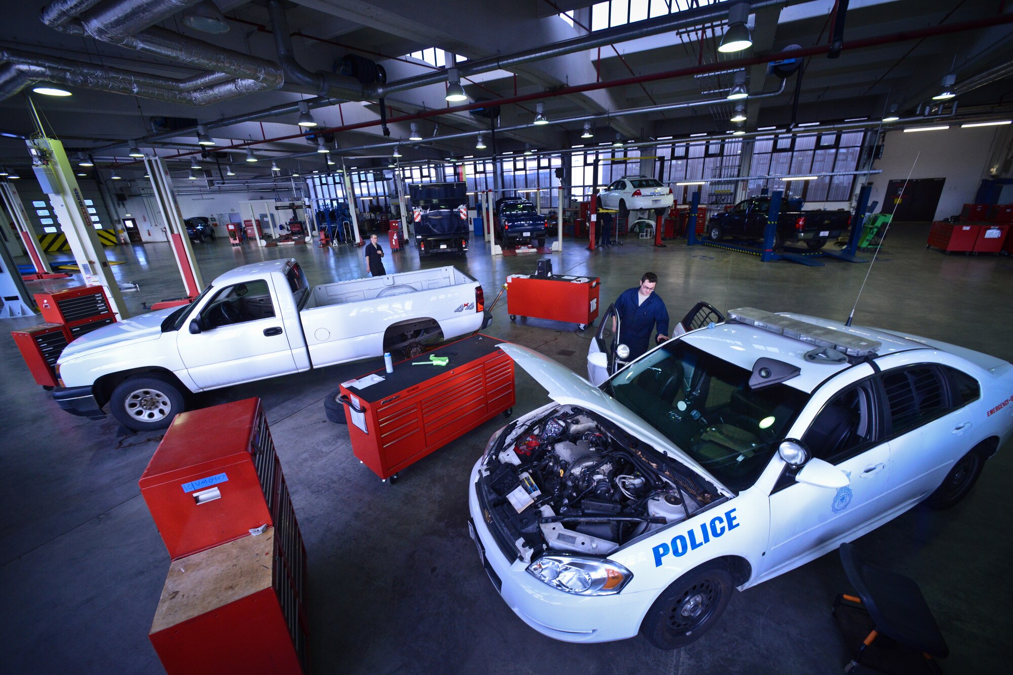 Airmen assigned to the 86th Vehicle Readiness Squadron general purpose light vehicle flight work at Ramstein Air Base, Germany, Jan. 14, 2015.  The GP light mission is to ensure that vehicles are safe and serviceable to complete the mission that’s required of them. (U.S. Air Force photo by Senior Airman Nicole Sikorski/Released)