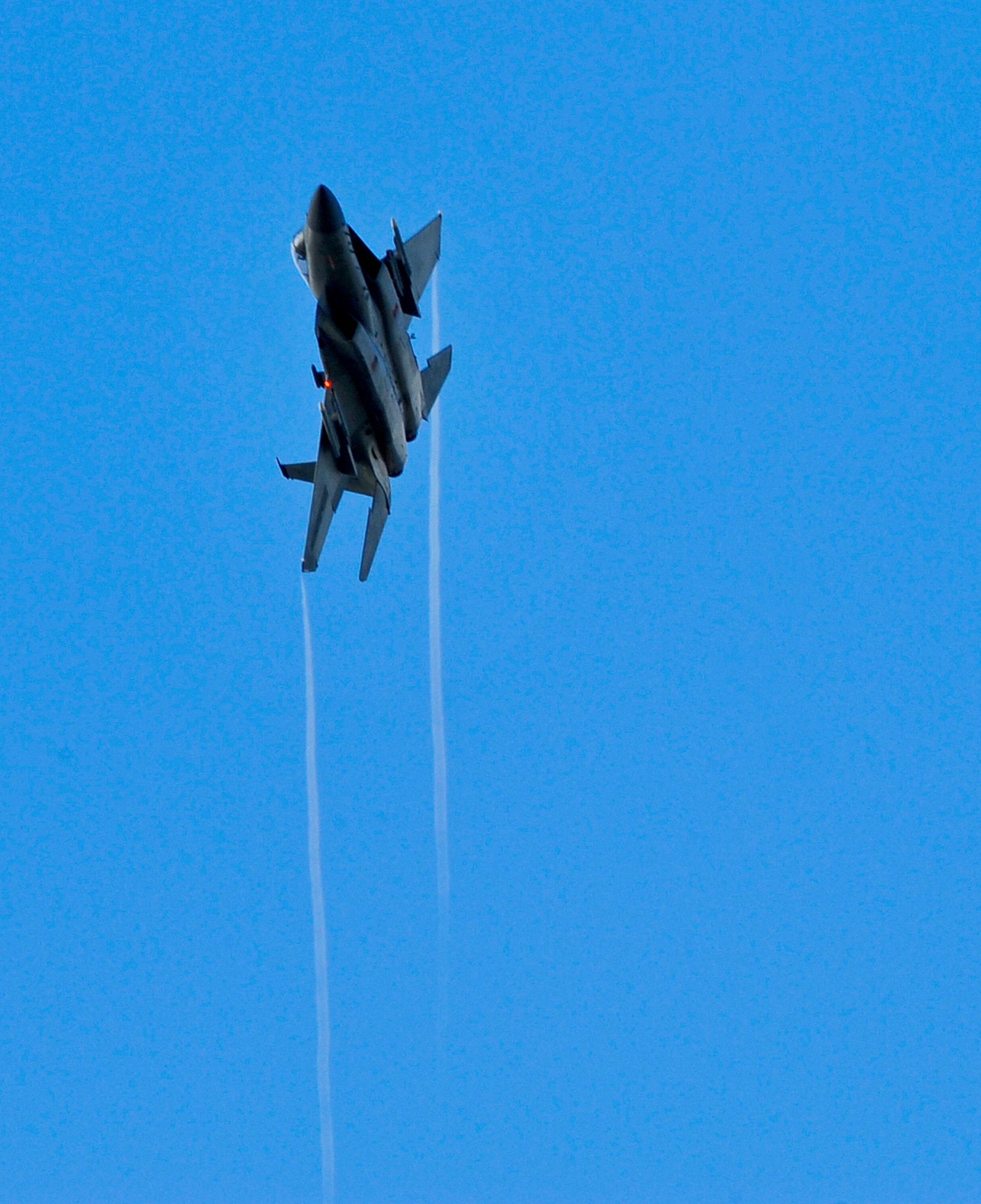 A U.S. Air Force F-15C Eagle from the 44th Fighter Squadron flies over Kadena Air Base, Japan, during a training surge, Jan. 15, 2015. Normally, the unit flies about 70 sorties in four days but during a surge, the unit will fly roughly 70 or more sorties in one day. (U.S. Air Force photo by Naoto Anazawa)