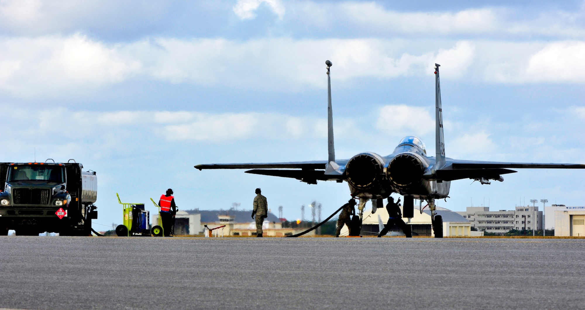 U.S. Air Force Airmen from 44th Aircraft Maintenance Unit refuel an F-15C Eagle during a training surge on Kadena Air Base, Japan, Jan. 15, 2015. The surge allows the unit to get ahead of the flying-hour program and gives them the ability to test their maximum production capacity. (U.S. Air Force photo by Naoto Anazawa)
