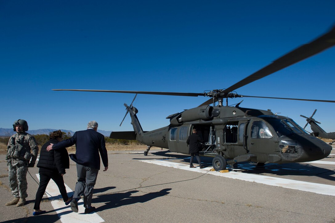 Defense Secretary Chuck Hagel and his wife, Lilibet, move to an UH-60 Black Hawk helicopter at Orogrande Range, N.M., Jan. 15, 2015. 