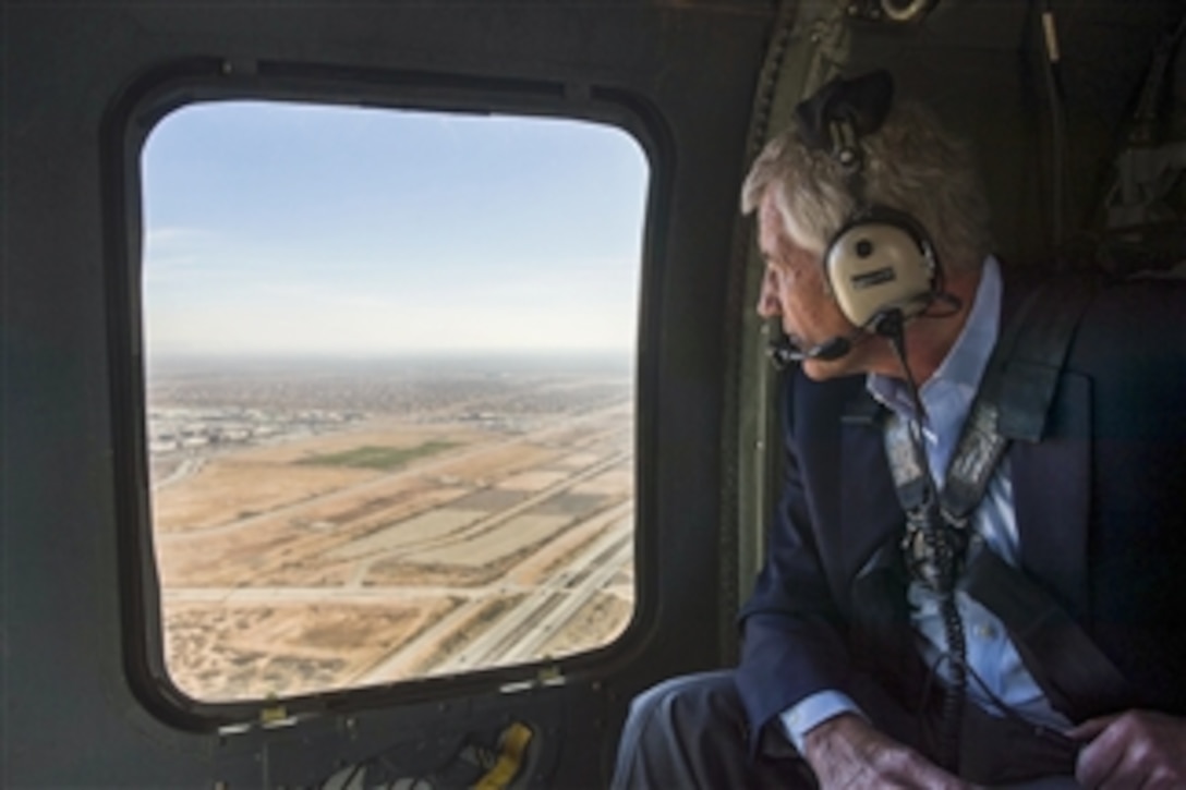 Defense Secretary Chuck Hagel looks out the window of an UH-60 Black Hawk helicopter while flying from Fort Bliss, Texas, to Orogrande Range, N.M., Jan. 15, 2015. Hagel tested the experimental FIM-43 Redeye as an enlisted soldier at Orogrande Range before volunteering to deploy to Vietnam. 