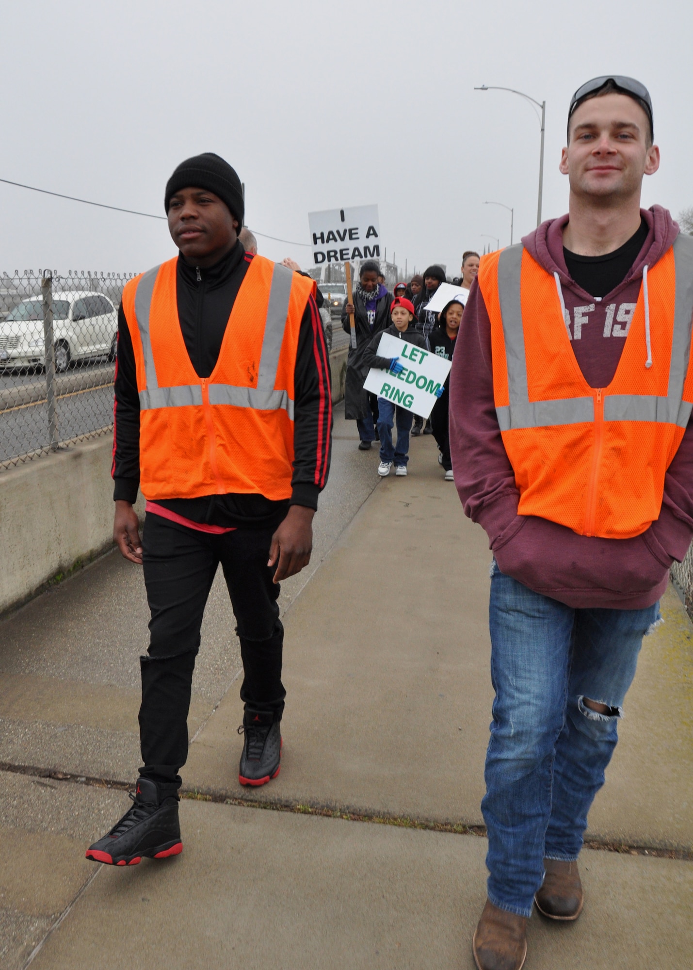 Senior Airman Matthew Lane (left) and Airman 1st Class Stephen Runge (right), both heavy equipment operators from the 9th Civil Engineer Squadron at Beale Air Force Base, volunteer as lead crossing guards at the march in the Martin Luther King community event, Saturday, Jan. 17, 2015 in Marysville, Calif. (U.S. Air Force photo by Tech. Sgt. Heather Rose Skinkle/Released)