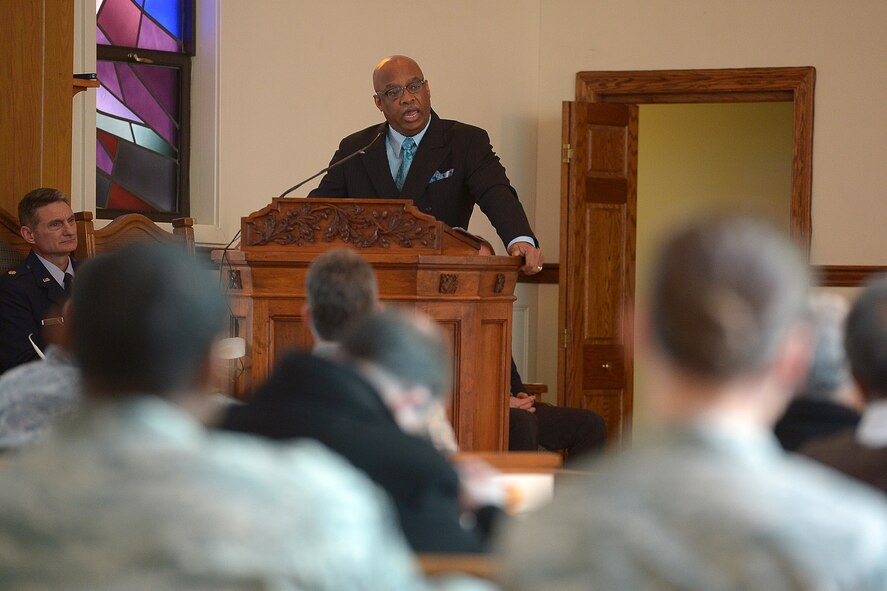 Dr. Quincy “Doc” Mosby, the keynote speaker, speaks during the Dr. Martin Luther King, Jr. birthday celebration at the base chapel Jan. 16. The event also featured an "I Have a Dream" speech reenactment by Timothy Martin, 66th Security Forces Squadron, and special music performance by Maresa Kelleher and Kathy Lynch. (U.S. Air Force photo by Rick Berry)