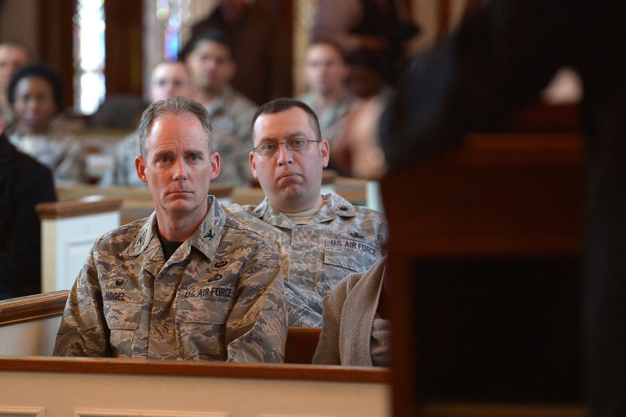 Col. Michael A. Vogel, 66th Air Base Group commander, listens as Timothy Martin, 66th Security Forces Squadron, reenacts the Dr. Martin Luther King, Jr. “I Have a Dream” speech during an MLK birthday celebration at the base chapel Jan. 16. This year’s MLK observance focused on the theme “Remember! Celebrate! A Day of Service.” (U.S. Air Force photo by Jerry Saslav)