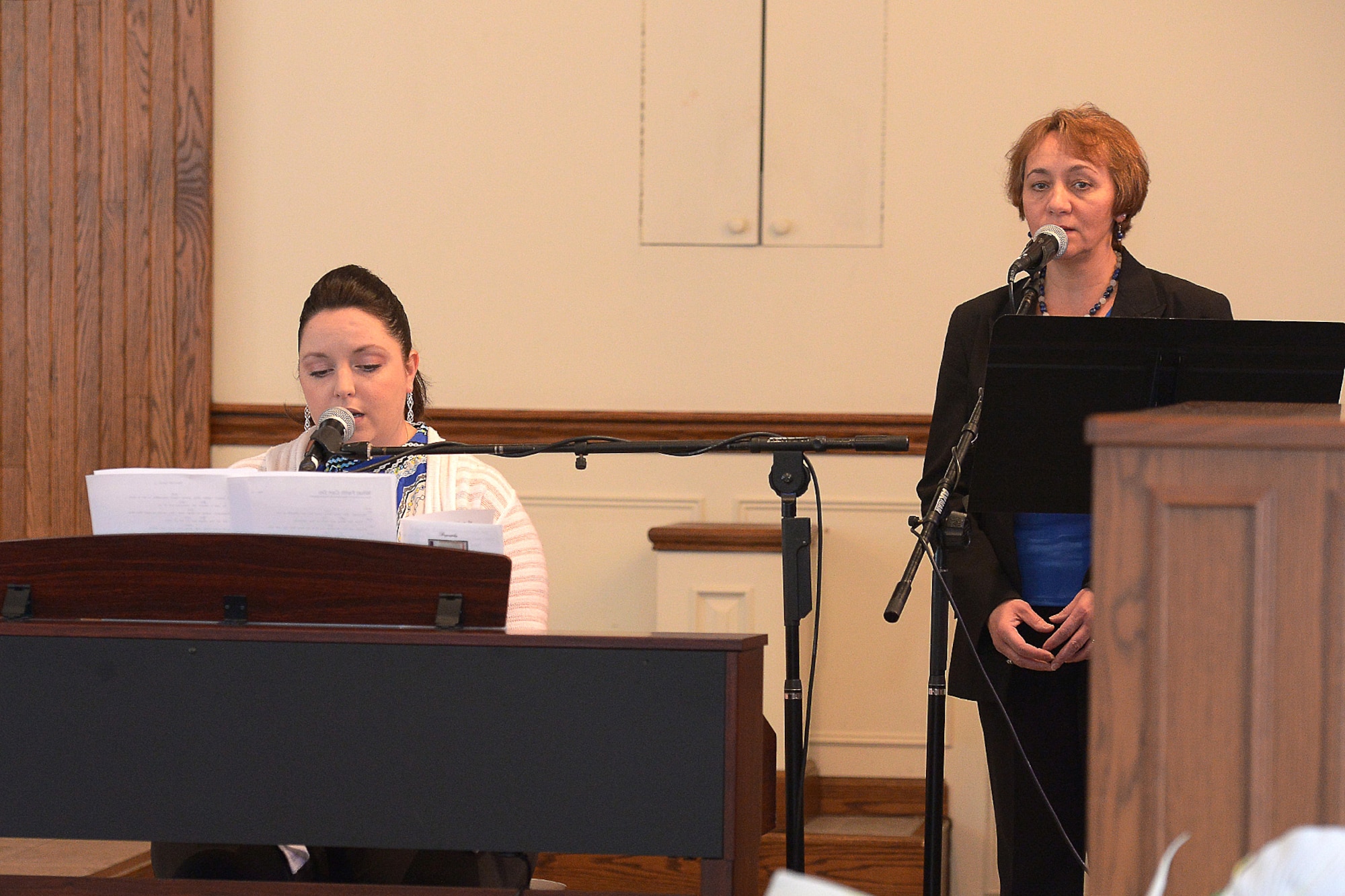 Maresa Kelleher and Kathy Lynch perform special music during a celebration to remember the life of Dr. Martin Luther King, Jr. at the base chapel Jan. 16. President Ronald Reagan signed a bill into law Nov. 2, 1983 at the White House declaring the third Monday in January each year as a federal holiday to honor King, which is around the time of his birthday, Jan. 15. The holiday was first observed Jan. 20, 1986. (U.S. Air Force photo by Jerry Saslav)