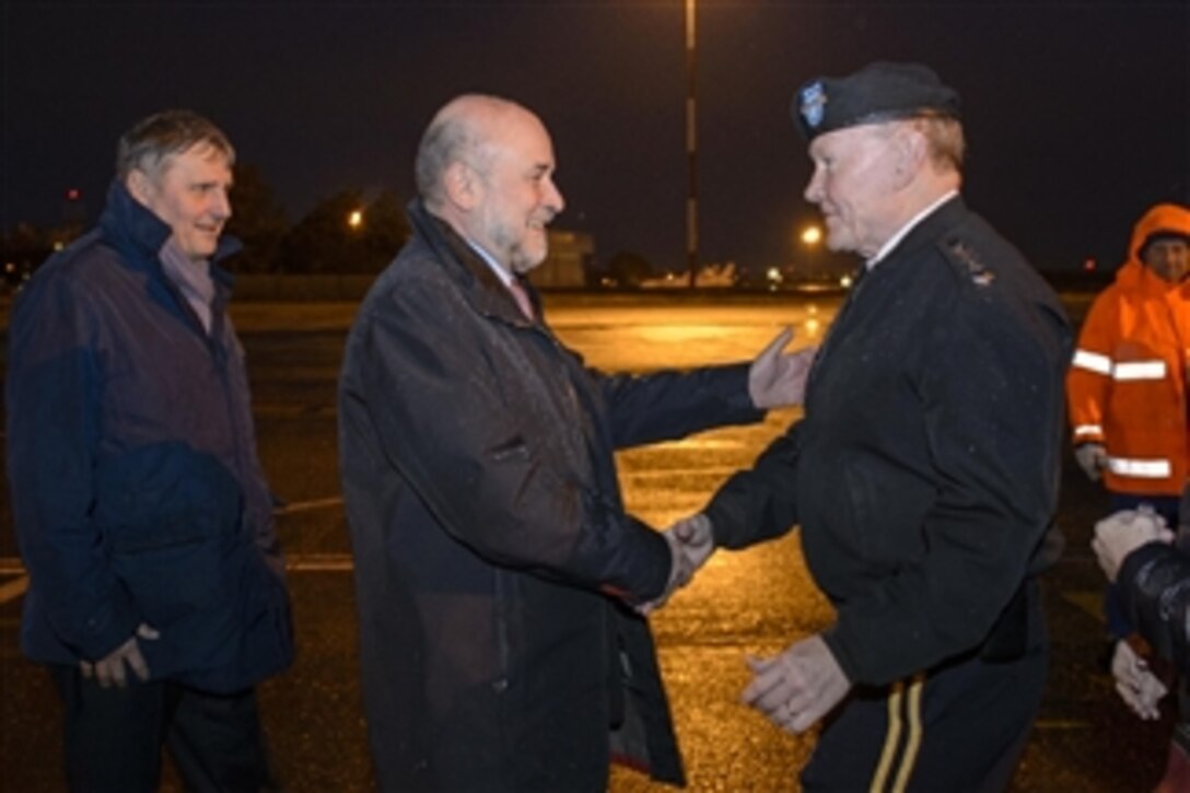 U.S. Army Gen. Martin E. Dempsey, chairman of the Joint Chiefs of Staff, shakes hands with his Italian counterpart, Chief of Defense Navy Adm. Luigi Binelli Mantelli, upon landing in Rome, Jan. 18, 2015. Dempsey met with senior Italian defense leaders to discuss issues of mutual importance before attending a two-day NATO Military Committee conference in Brussels. 