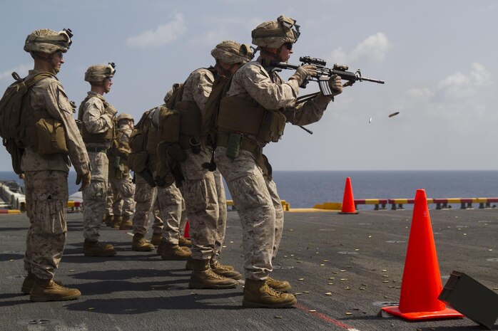 Marines from the 24th Marine Expeditionary Unit participate in a live-fire  exercise aboard the amphibious assault ship USS Iwo Jima (LHD 7), Jan. 18, 2015. The 24th MEU is embarked on the ships of the Iwo Jima Amphibious Ready Group and deployed to maintain regional security in the U.S. 5th Fleet area of operations. (U.S. Marine Corps photo by Lance Cpl. Dani A. Zunun)