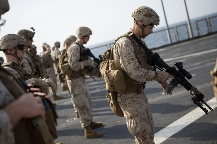 Marines with Kilo Company, Battalion Landing Team 3rd Battalion, 6th Marine Regiment, 24th Marine Expeditionary Unit, perform  tactical reloads during a live-fire exercise aboard the amphibious dock landing ship USS Fort McHenry (LSD 43), Jan. 16, 2015. The 24th MEU is embarked on the ships of the Iwo Jima Amphibious Ready Group and deployed to maintain regional security in the U.S. 5th Fleet area of operations. (U.S. Marine Corps photo by Sgt. Devin Nichols)