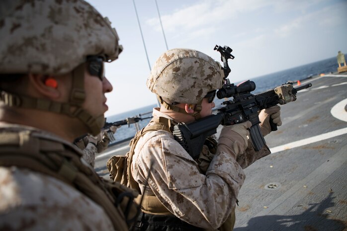 A Marine with Kilo Company, Battalion Landing Team 3rd Battalion, 6th Marine Regiment, 24th Marine Expeditionary Unit, takes part in  a live-fire exercise aboard the amphibious dock landing ship USS Fort McHenry (LSD 43), Jan. 16, 2015. The 24th MEU is embarked on the ships of the Iwo Jima Amphibious Ready Group and deployed to maintain regional security in the U.S. 5th Fleet area of operations. (U.S. Marine Corps photo by Sgt. Devin Nichols)