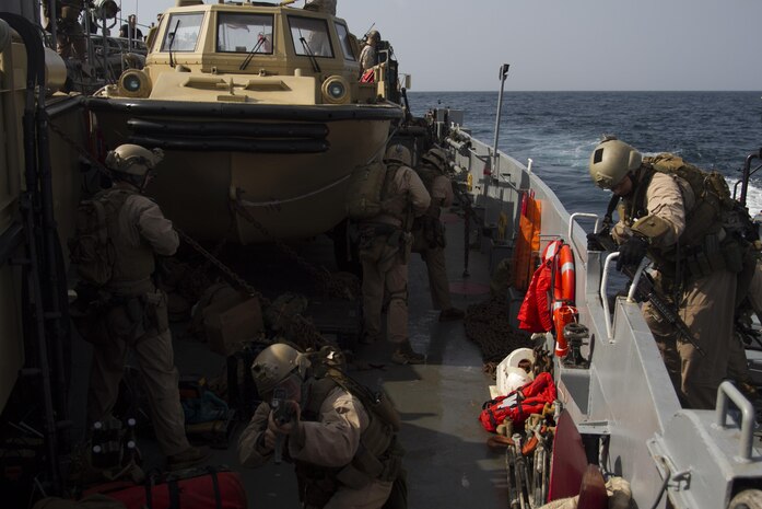 Members of the 24th Marine Expeditionary Unit’s Maritime Raid Force, a detachment from Force Reconnaissance Company, 2nd Reconnaissance Battalion, board and provide security during a visit, board, search and seizure exercise aboard a Navy Landing Craft Utility, Jan. 15, 2015. The MRF conducted the VBSS exercise from the amphibious dock landing ship USS Fort McHenry (LSD 43). The 24th MEU is embarked on the ships of the Iwo Jima Amphibious Ready Group and deployed to maintain regional security in the U.S. 5th Fleet area of operations. (U.S. Marine Corps photo by Lance Cpl. Dani A. Zunun)