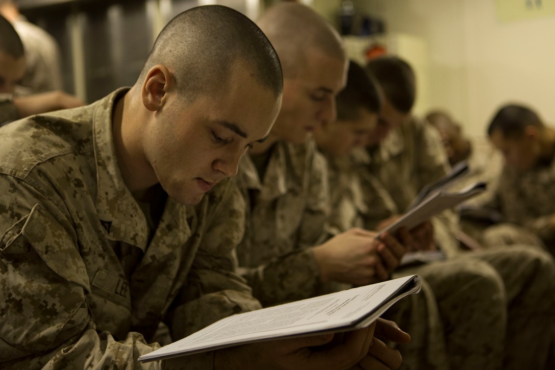 Lance Cpls. with Kilo Company, Battalion Landing Team 3rd Battalion, 6th Marine Regiment, 24th Marine Expeditionary Unit, read an article during  a Lance Corporal’s Leadership and Ethics Seminar aboard the amphibious dock landing ship USS Fort McHenry (LSD 43), Jan. 14, 2015. The 24th MEU is embarked on the ships of the Iwo Jima Amphibious Ready Group and deployed to maintain regional security in the U.S. 5th Fleet area of operations. (U.S. Marine Corps photo by Sgt. Devin Nichols)