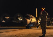 Staff Sgt. Alex Bryden, 901st Aircraft Maintenance Squadron crew chief, marshals an MC-130H Combat Talon II to its parking spot at Hurlburt Field, Fla., Jan. 8, 2015. The 7th Special Operations Squadron, RAF Mildenhal, England transferred their last two Talons to the 15th Special Operations Squadron because they transitioned to the CV-22 Osprey mission. (U.S. Air Force photo/Airman 1st Class Jeff Parkinson) 