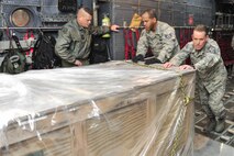 Chief Master Sgt. Cory Olson, 1st Special Operations Wing command chief, helps off-load an MC-130H Combat Talon II at Hurlburt Field, Fla., Jan. 8, 2015. The 7th Special Operations Squadron, RAF Mildenhal, England transferred their last two Talons to the 15th Special Operations Squadron because they transitioned to the CV-22 Osprey mission. (U.S. Air Force photo/Airman 1st Class Jeff Parkinson) 