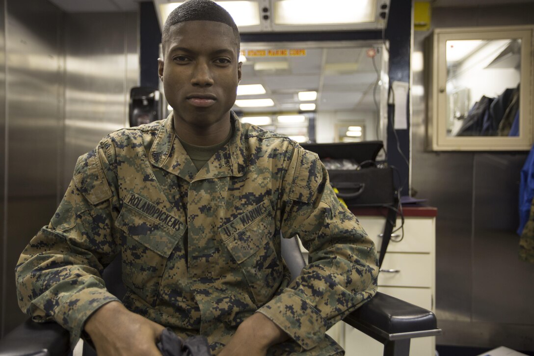 Cpl. Malik S. RolandPickens, a warehouse clerk with Combat Logistics Battalion 24, 24th Marine Expeditionary Unit, poses for a picture aboard the USS Fort McHenry, at sea, Jan. 6, 2015. (U.S. Marine Corps photo by Sgt. Devin Nichols)