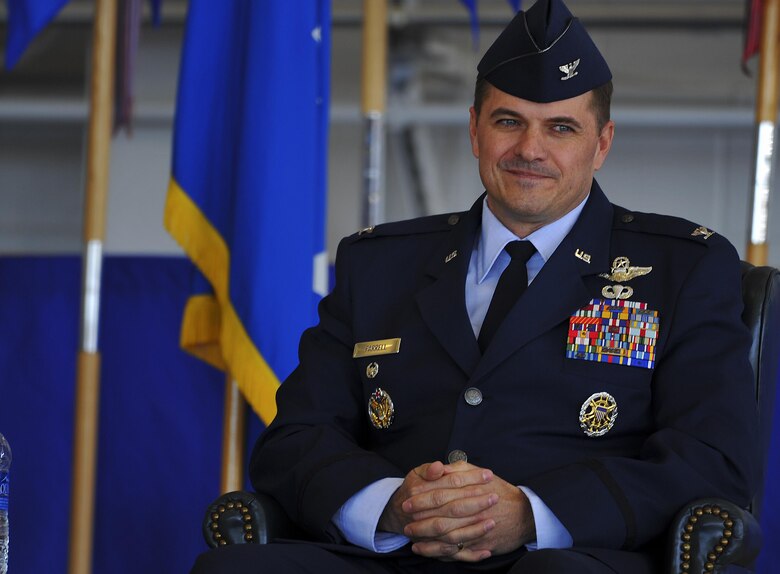 Col. Sean Farrell, 1st Special Operations Wing commander, assumes command during the 1st Special Operations Wing change of command ceremony at the Freedom Hangar on Hurlburt Field, Fla., Jan. 6, 2015. The primary mission of the 1st SOW is to rapidly plan and execute specialized and contingency operations in support of national priorities. (U.S. Air Force photo/Senior Airman Christopher Callaway)

