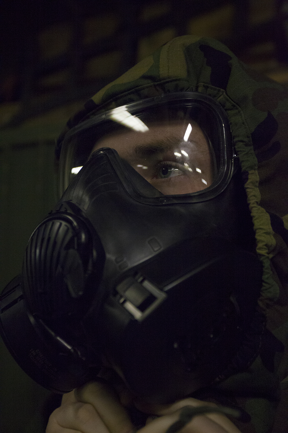 A Marine with Headquarters and Service Company, Battalion Landing Team 3rd Battalion, 6th Marine Regiment, 24th Marine Expeditionary Unit, participates in a drill to don-and-clear his mission-oriented protective posture (MOPP) gear while aboard USS Iwo Jima (LHD 7) Jan. 8, 2015. The 24th MEU and Iwo Jima Amphibious Ready Group are conducting naval operations in the U.S. 6th Fleet area of operations in support of U.S. national security interests in Europe. (U.S. Marine Corps photo by Lance Cpl. Austin A. Lewis)