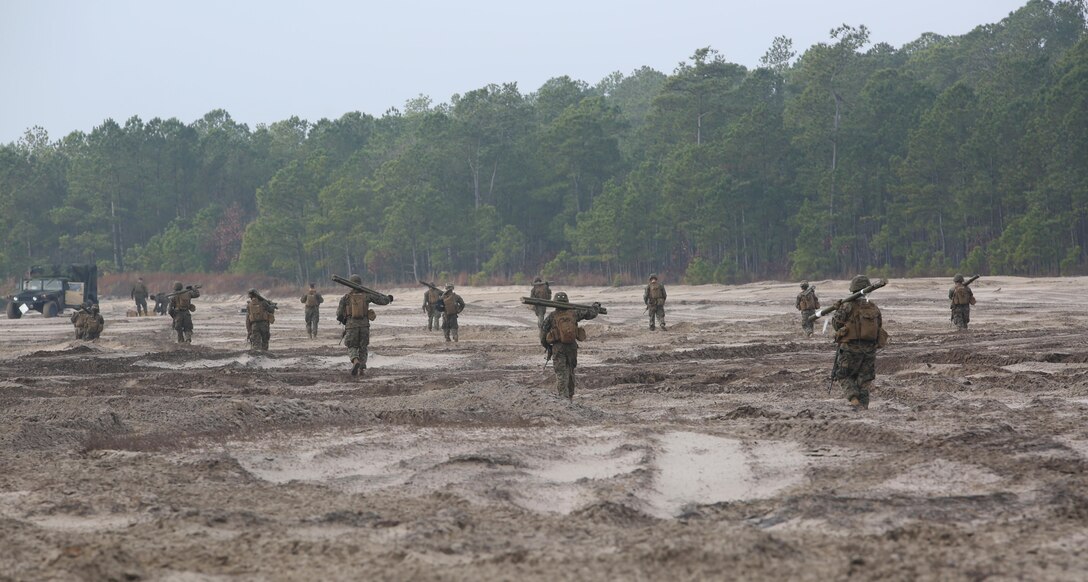 Marines with Engineer Platoon, Headquarters and Service Company, Ground Combat Element Integrated Task Force, conduct a patrol during a field training exercise at Engineer Training Area 2 aboard Marine Corps Base Camp Lejeune, North Carolina, Jan. 16, 2015. From October 2014 to July 2015, the GCEITF will conduct individual and collective level skills training in designated ground combat arms occupational specialties in order to facilitate the standards based assessment of the physical performance of Marines in a simulated operating environment performing specific ground combat arms tasks. (U.S. Marine Corps photo by Cpl. Paul S. Martinez/Released)