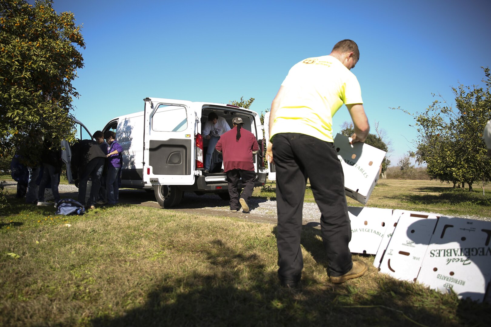 Volunteers at Second Harvest Food Bank in Belle Chasse, La. Package kumquats and load them onto a van for shipment Saturday, Jan. 17, 2015. Marines and Sailors from Marine Forces Reserve and Naval Air Station Joint Reserve Base New Orleans gathered with local community members to harvest a citrus orchard, where the fruit was then packaged for distribution to food banks, pantries and shelters across south Louisiana. Since the beginning of 2015, MARFORRES volunteers have completed 211 service hours in eight different community service projects.  (U.S. Marine Corps photo by Cpl. Tiffany Edwards)