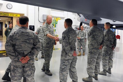 General Craig R. McKinley, chief of the National Guard Bureau, meets with instructors at the 174th Fighter Wing's Field Training Detachment, which trains all MQ-9 Reaper maintenance personnel to perform various maintenance functions. The detachment is responsible for training all Air Force components: active duty Air Force, Air National Guard and Air Force Reserve personnel