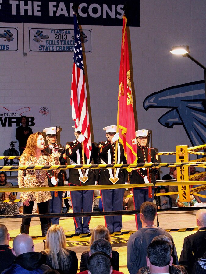 Marines with Recruiting Station Frederick took part in the color guard for the 16th annual Toughman Competition at Frankfort High School in Short Gap, West Virginia, Jan. 17, 2015. The national anthem was performed by Chrissy Armel from Winchester, Virginia. Marines from left to right; Sgt. Daniel Sanford from Neptune, New Jersey,  Staff Sgt. David Shirey from Palm Beach Gardens, Florida,  Staff Sgt. Joseph Steenhoven from Virginia Beach, Virginia and  Staff Sgt. Scott C. Webb from Soldotna, Alaska.  (U.S. Marine Corps photo by Cpl. Amber Williams/Released)