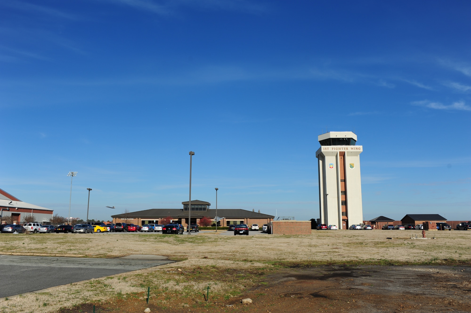 An F-22 Raptor takes off after receiving confirmation from the 1st Operations Support Squadron air traffic control tower at Langley Air Force Base, Va., Jan. 20, 2015. The control tower supports approximately 30,000 missions annually and communicates with local flight facilities to coordinate safe air traffic. (U.S. Air Force photo by Staff Sgt. Natasha Stannard/Released)