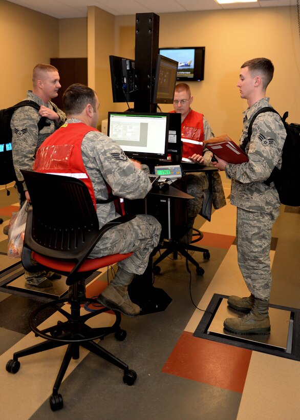Ellsworth Airmen process through a mobility line in the deployment center at Ellsworth Air Force Base, S.D., Jan. 20, 2015. Approximately 350 Ellsworth Airmen deployed in support of Operation Freedom’s Sentinel and Operation Inherent Resolve, providing combatant commanders critical air presence, precision strike and surveillance and reconnaissance capabilities. Airmen in a variety of non-aviation roles will perform sortie generation and mission assurance duties. (U.S. Air Force photo by Airman 1st Class Rebecca Imwalle/Released)