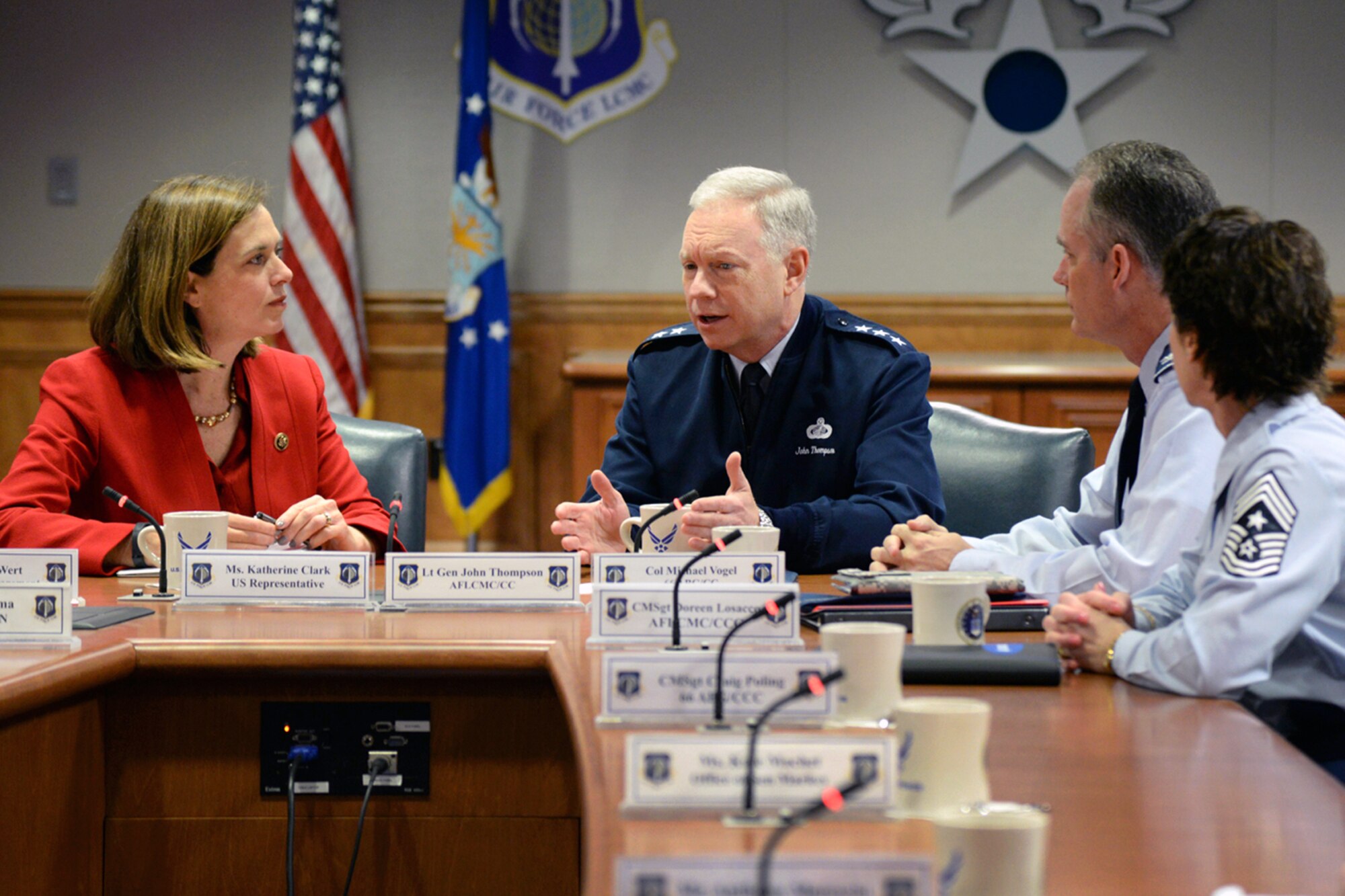 Lt. Gen. John Thompson (center), Air Force Life Cycle Management Center commander, talks with U.S. Rep. Katherine Clark in Building 1606, as Col. Michael Vogel, 66th Air Base Group commander, and AFLCMC Command Chief Master Sgt. Doreen Losacco look on. Among other topics, the general and the congresswoman discussed the value of regional partnerships and assets. Staff members representing U.S. Senator Elizabeth Warren also participated in the meeting. (U.S. Air Force photo by Linda LaBonte Britt)